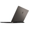 Na zdjęciu widoczny jest laptop z otwartą pokrywą, na której znajduje się logo producenta w kształcie tarczy z głową smoka. Laptop ma nowoczesny design z widocznymi portami i otworami wentylacyjnymi na boku.