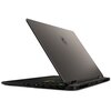 Laptop z otwartą pokrywą, na której widoczne jest logo producenta. Klawiatura podświetlana w różnych kolorach, a na bocznej krawędzi znajdują się porty i złącza.