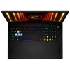 Na zdjęciu widoczny jest otwarty laptop z podświetlaną klawiaturą w różnych kolorach, a na ekranie znajduje się logo smoka na tle pomarańczowych linii. Obudowa laptopa jest czarna, a touchpad znajduje się poniżej klawiatury.