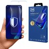 Na zdjęciu widoczna jest dłoń trzymająca telefon z nałożonym szkłem ochronnym, obok znajduje się opakowanie produktu z napisem "3mk FlexibleGlass Pro™ Feel the power". Na opakowaniu widoczne są również ikony certyfikatów i nagród oraz napis "Unbreakable G