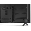 Tył telewizora z widocznymi portami i złączami, w tym HDMI i USB, oraz otworami wentylacyjnymi. Obudowa jest czarna, a telewizor stoi na nóżkach.