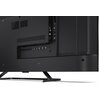 Tył telewizora z widocznymi portami HDMI, USB oraz innymi złączami. Obudowa jest czarna, a telewizor stoi na metalowej podstawie.