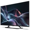 Na zdjęciu znajduje się telewizor marki Sharp z dużym ekranem, na którym widoczna jest abstrakcyjna grafika w odcieniach fioletu i niebieskiego. Na dolnej ramce telewizora znajduje się logo "SHARP".