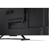Tył telewizora z widocznymi portami HDMI, USB oraz innymi złączami, umieszczonymi w panelu bocznym. Obudowa jest czarna, a telewizor stoi na metalowej podstawie.