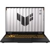 Laptop z podświetlaną klawiaturą w kolorze pomarańczowym, na ekranie widoczne jest logo w kształcie litery "V" oraz napisy "TUF" i "STAY TOUGH". Obudowa ekranu ma wzór przypominający metalowe panele.