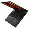 Laptop z częściowo otwartym ekranem, na którym widoczny jest kolorowy wzór. Klawiatura podświetlana w różnych kolorach, obok touchpada znajduje się logo producenta.