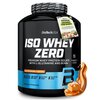 Czarny pojemnik z białym napisem "BioTechUSA ISO WHEY ZERO" oraz informacjami o produkcie: "Premium Whey Protein Isolate with L-Glutamine and BCAAs", "Salted Caramel Flavoured", "Lactose Reduced", "Sugar Free", "Gluten Free", "Palm Oil Free". Na dole widn