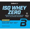 Na zdjęciu widoczna jest etykieta produktu "Iso Whey Zero" marki BioTechUSA, z informacją o smaku bananowym i zawartości 1816 gramów (72 porcje). Etykieta podkreśla, że produkt jest bez laktozy, cukru, glutenu i oleju palmowego, a także zawiera izolaty bi