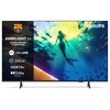 Telewizor wyświetla obraz przedstawiający syrenę pływającą wśród ryb w kolorowym podwodnym świecie, z logo PHILIPS w rogu. Po lewej stronie ekranu widnieje tekst: "AMBILIGHT tv GŁÓWNY PARTNER FC BARCELONA 4K UltraHD Pixel Precise ULTRA HD HDR10+ Dolby ATM