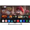 Telewizor wyświetla ekran główny Google TV z filmem "The Super Mario Bros. Movie" oraz aplikacjami takimi jak Netflix, YouTube, Prime Video, Disney+, Apple TV, i inne. Na ekranie widoczne są także ikony aplikacji oraz teksty: "Trending | Brooklyn plumbers