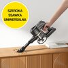 Na zdjęciu widoczny jest odkurzacz ręczny z napisem "DREAME", używany do sprzątania powierzchni drewnianej z rozsypanymi drobinkami. W lewym górnym rogu znajduje się żółte koło z czarnym napisem "SZEROKA SSAWKA UNIWERSALNA".