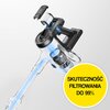Bezprzewodowy odkurzacz z przezroczystym pojemnikiem na kurz i widocznym przepływem powietrza, obok żółtego koła z napisem "SKUTECZNOŚĆ FILTROWANIA DO 99%".