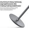 Na zdjęciu widoczny jest fragment stojaka z okrągłą podstawą i pionowym prętem, wykonany z metalu o gładkiej powierzchni. W tle znajduje się tekst: "Aluminium klasy lotniczej, zaprojektowane dla maksymalnej stabilności. Wzmocniona, dociążona podstawa i wy