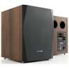 Na zdjęciu widoczny jest subwoofer w kolorze orzechowym z czarnym frontem, na którym znajduje się logo "PYLON". Tył urządzenia posiada panel z różnymi złączami i oznaczeniami, w tym logo "PYLON" oraz symbole CE.