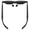 Czarne okulary z ciemnymi szkłami, wyposażone w douszne słuchawki przymocowane do wewnętrznej strony oprawek. Produkt ma smukły, nowoczesny design z widocznymi przyciskami na zausznikach.