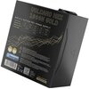 Na zdjęciu znajduje się czarny zasilacz z widocznym napisem "VOLCANO HEX 1000W GOLD" oraz tabelą specyfikacji technicznej dotyczącą wyjść napięcia. Na dole widoczne są logotypy certyfikatów, kod kreskowy, kod QR oraz logo "VOLCANO MODECOM".