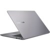 Na zdjęciu widoczny jest otwarty laptop w kolorze srebrnym z logo "ASUS EXPERTBOOK" na pokrywie. Laptop jest ustawiony pod kątem, ukazując klawiaturę i porty z boku.