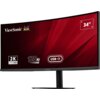 Zakrwiony monitor ViewSonic z zakrzywionym ekranem, na którym widoczne są napisy: "ViewSonic", "2K UWQHD", "120Hz", "USB-C" oraz "34"". Tło ekranu jest czerwone z geometrycznymi wzorami.