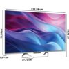 Telewizor z wyświetlaczem o przekątnej 55 cali, z kolorowym, abstrakcyjnym tłem na ekranie, posiada wymiary: szerokość 122,58 cm, wysokość 77,73 cm, głębokość 27,72 cm oraz wysokość bez podstawy 71,94 cm. Na dolnej ramce widoczne jest logo "Haier".