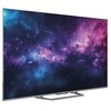 Telewizor z cienką ramką wyświetla obraz kosmosu z fioletowymi i niebieskimi mgławicami oraz gwiazdami. Na dolnej ramce widoczne jest logo "Haier".