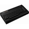 Czarna konsola z klawiaturą, na której widnieje napis "THE C64" z kolorowym paskiem. Klawisze są oznaczone literami i symbolami, a w prawym górnym rogu znajduje się czerwony wskaźnik.