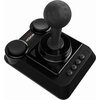 Czarny joystick z dużą gałką i kilkoma przyciskami na podstawie, z widocznym logo "THEC64" w kolorach tęczy. Produkt ma nowoczesny design z matowym wykończeniem.