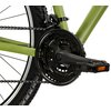 Na zdjęciu widoczny jest fragment roweru górskiego w kolorze khaki, skupiający się na mechanizmie korbowym, łańcuchu i pedałach. Na ramie roweru znajduje się napis "Tourney TZ".