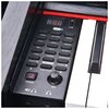 Panel sterowania pianina cyfrowego z wyświetlaczem LED pokazującym "188", przyciskami funkcyjnymi takimi jak TONE, RHYTHM, DEMO, oraz pokrętłem głośności oznaczonym jako VOL. Widoczne są także port USB oraz symbole słuchawek i zasilania.