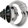 Szary smartwatch z okrągłym wyświetlaczem pokazuje godzinę 08:26:00, datę APR 06, dzień tygodnia WEDNESDAY oraz informacje o krokach i spalonych kaloriach. Na obudowie widoczne są przyciski z oznaczeniami MENU i SPORT.