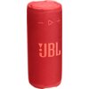 Czerwony głośnik mobilny z widocznym logo "JBL" na powierzchni, posiada teksturowaną obudowę oraz przyciski sterujące w górnej części.