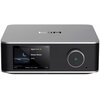 Srebrny wzmacniacz z wyświetlaczem pokazującym okładkę albumu z księżycem, tekst "amazon music HD", "Sleep Music", "WiiM", oraz czas odtwarzania "01:23" i "03:02". Obok wyświetlacza znajduje się duże pokrętło z przyciskiem odtwarzania.