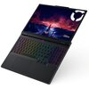 Na zdjęciu widoczny jest otwarty laptop z kolorowo podświetlaną klawiaturą i ekranem wyświetlającym grafikę z motywem gór i burzy. Na ekranie znajduje się logo "Lenovo LEGION".