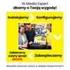 Na zdjęciu widoczny jest laptop z otwartą stroną internetową, wokół którego stoją trzy osoby w sklepie Media Expert. Na żółtym tle znajdują się napisy: "Instalujemy", "Konfigurujemy", "Odbieramy zużyty sprzęt GRATIS!", "Zabezpieczamy" oraz "Wszystko podcz