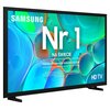 Telewizor z kolorowym ekranem wyświetla tekst: "SAMSUNG Nr 1 NA ŚWIECIE Najczęściej kupowane telewizory od 19 lat". W dolnej części ekranu znajduje się dodatkowy tekst informacyjny oraz oznaczenie "HD TV".