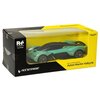 Pudełko zawiera zdalnie sterowany model samochodu Aston Martin Valkyrie w kolorze turkusowym z czarnymi elementami, widoczny przez przezroczyste okienko. Na opakowaniu znajdują się napisy: "RW No. 27324M", "Valkyrie", oraz "Scale 1:24 Radio Control Aston 