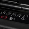 Na zdjęciu widoczny jest panel sterowania bieżni elektrycznej z przyciskami oznaczonymi jako "3", "6", "9", "12", "+", "-", "STOP" oraz "MODE", a nad nimi napis "SPEED". Przyciski "STOP" i "MODE" są wyróżnione obramowaniem, przy czym "STOP" ma czerwone ob