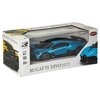 Pudełko z modelem zdalnie sterowanego samochodu Bugatti Divo w skali 1:24, z widocznym niebieskim pojazdem przez przezroczyste okienko. Na opakowaniu znajdują się napisy: "BUGATTI DIVO", "Scale 1:24", "Radio Control", "AGE 6+", "24 GHz", oraz logo "R/C" i