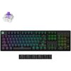 Na zdjęciu znajduje się klawiatura mechaniczna z podświetleniem RGB, z klawiszami oznaczonymi m.in. jako "esc", "shift", "ctrl", "alt", "enter" oraz klawiatura numeryczna. Obok klawiatury widoczny jest przełącznik mechaniczny oraz dodatkowe klawisze z ozn