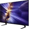 Telewizor z cienką ramką wyświetla dynamiczny, abstrakcyjny obraz w odcieniach fioletu i złota. Na dolnej ramce widoczne jest logo "SAMSUNG".