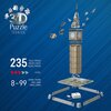 Na niebieskim tle widoczny jest model 3D wieży zegarowej z puzzli, z unoszącymi się elementami wokół. Po lewej stronie znajduje się tekst: "3D Puzzle Iconics", "235 Teile | Pieces | Pezzi | Peças | Piezas", "Level", "8-99 Jahre | Years | Ans | Anni | Años