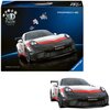 Pudełko z puzzlami 3D przedstawia model samochodu wyścigowego z widocznymi napisami "Porsche 911 GT3 CUP", "MICHELIN", "CHOPARD" oraz logo "Ravensburger". Na opakowaniu znajdują się również elementy puzzli oraz napis "3D Puzzle Iconics".