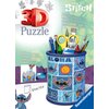 Na zdjęciu znajduje się opakowanie produktu "Puzzle 3D RAVENSBURGER Disney Stitch Przybornik 11642 (57 elementów)" z kolorowym przybornikiem ozdobionym motywami postaci Stitch z filmu Disney, wypełnionym przyborami biurowymi. Widoczny jest tekst: "3D Puzz