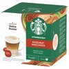 Kwadratowe opakowanie kapsułek do kawy z logo Starbucks i napisem "HAZELNUT MACCHIATO" oraz "SMOOTH WITH NUTTY NOTES", obok znajduje się filiżanka z kawą i kapsułki z napisem "STARBUCKS HAZELNUT MACCHIATO". Na opakowaniu widnieje również napis "by NESCAFÉ