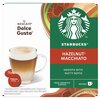 Opakowanie kapsułek do kawy NESCAFÉ Dolce Gusto z logo Starbucks, zawierające napis "Hazelnut Macchiato" oraz "Smooth with nutty notes". Na opakowaniu widoczny jest również obrazek filiżanki kawy oraz informacja "100% Arabica Coffee, Servings 6".