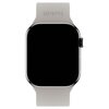 Beżowy pasek do zegarka z napisem "holdit" na górnej części, przymocowany do ciemnego ekranu zegarka. Pasek jest wykonany z silikonu i przeznaczony do zegarków Apple Watch.