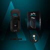 Na zdjęciu znajduje się golarka z wyświetlaczem pokazującym "100%", obok niej pudełko z napisem "SHAV COMPACT FACE SHAVER" oraz kabel USB i mała szczoteczka. Tło jest ciemne z niebieskimi akcentami, a na golarce i pudełku widoczne jest logo "SHAV".