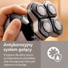 Na zdjęciu widoczna jest głowica golarki z czterema okrągłymi ostrzami, trzymana w dłoni, z logo "PHILIPS" oraz tekstem: "Antykorozyjny system golący. Przyjazne dla skóry ostrza są wykonane ze szwedzkiej stali chirurgicznej, która jest odporna na korozję.