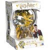 Opakowanie gry zręcznościowej z motywem Harry'ego Pottera zawiera przezroczystą kulę z labiryntem 3D w środku, ozdobioną złotymi i srebrnymi elementami. Na opakowaniu widnieje napis "Harry Potter", logo "Perplexus", oraz informacja o 70 przeszkodach i wie