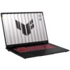 Czarny laptop z czerwonym podświetleniem klawiatury, na ekranie widoczny jest wzór złożony z ciemnych prostokątów oraz tekst "TUF" i inne drobne napisy. Obudowa ma nowoczesny design, a ekran jest otwarty pod kątem.