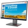 Monitor wyświetla prezentację z tytułem "Innovations & Growth" oraz tekstem o odnawialnych źródłach energii, na tle krajobrazu z turbinami wiatrowymi. Na obudowie monitora widoczne jest logo "Lenovo".